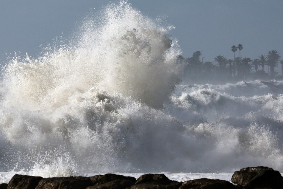 Large waves break near the beach in Ventura, California, on December 28, 2023.