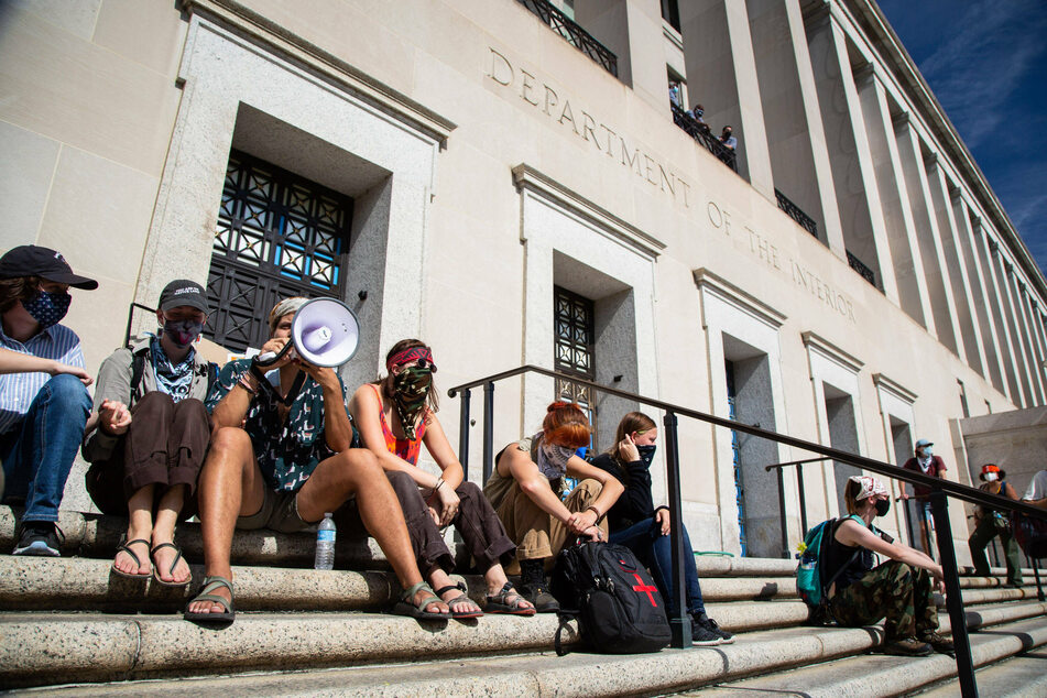 Indigenous activists and allies gathered inside and outside the Bureau of Indian Affairs in Washington DC to urge the Biden administration to pursue bolder climate action.