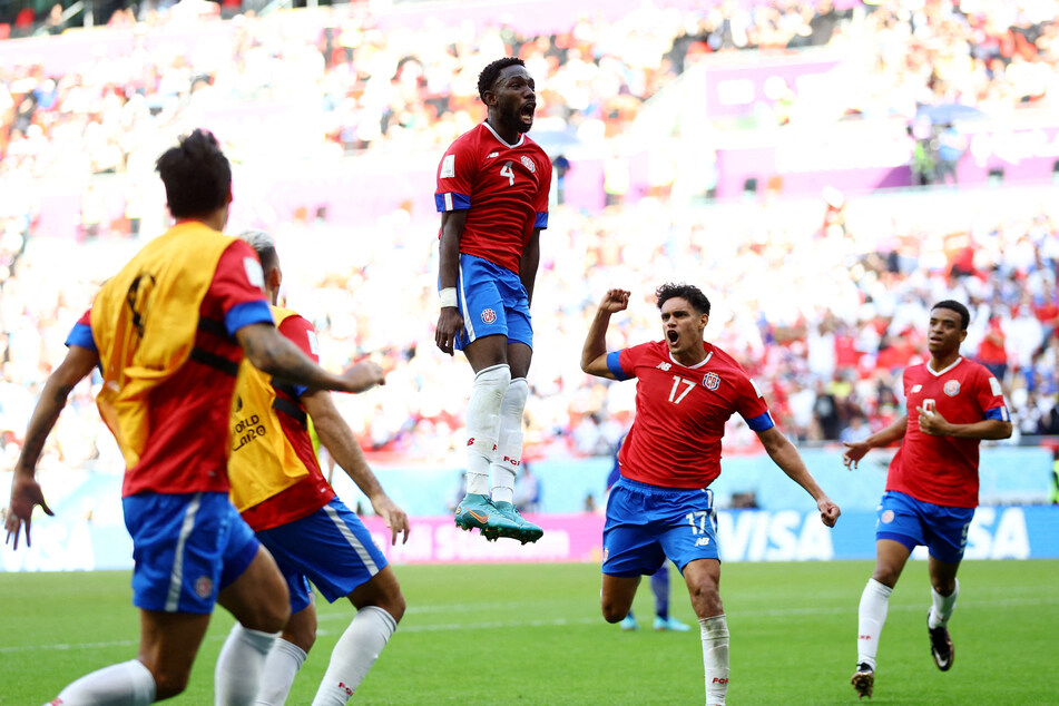 Costa Rica's Keysher Fuller celebrates scoring their first goal with Yeltsin Tejeda and teammates during their World Cup matchup against Japan.
