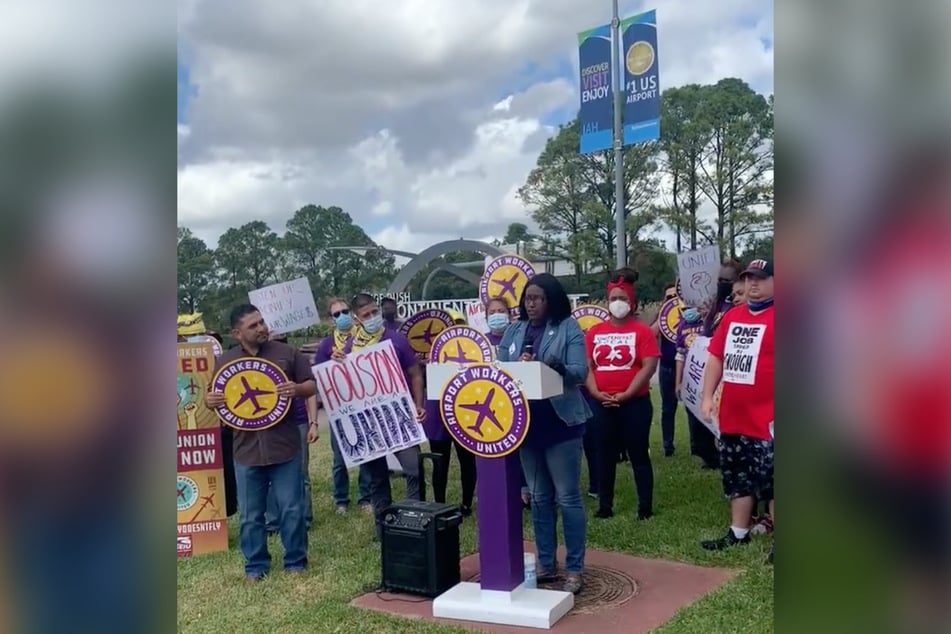 Teresa speaks to her co-workers about the importance of a $15-an-hour wage as living costs rise in Houston.