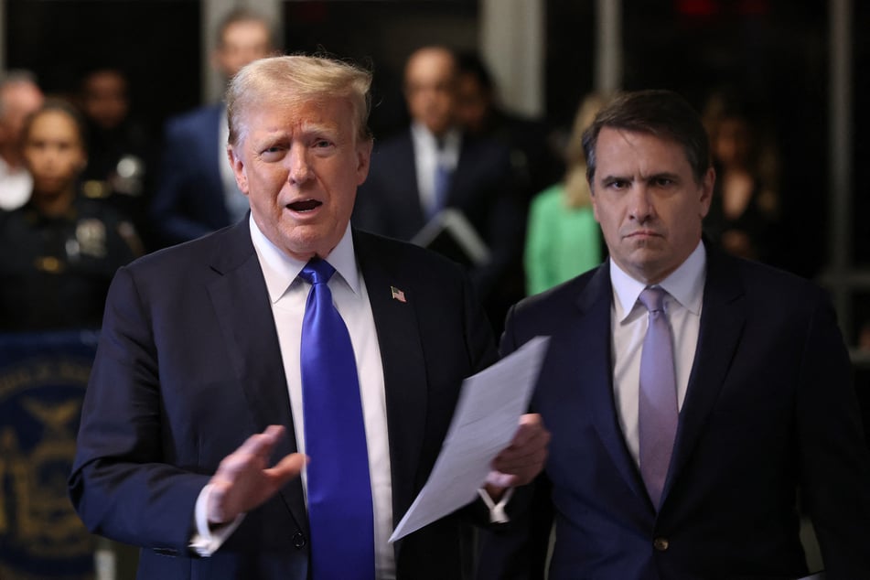 Donald Trump (l.), alongside his attorney Todd Blanche (r.), speaks to the media as he arrives for his criminal trial for allegedly covering up hush money payments at Manhattan Criminal Court on May 30, 2024 in New York City.