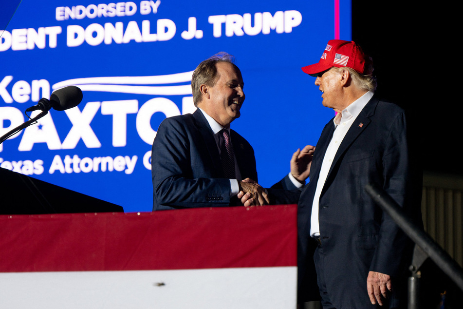 Texas Attorney General Ken Paxton (l.) with former president Donald Trump at a Texas rally in October 2022.