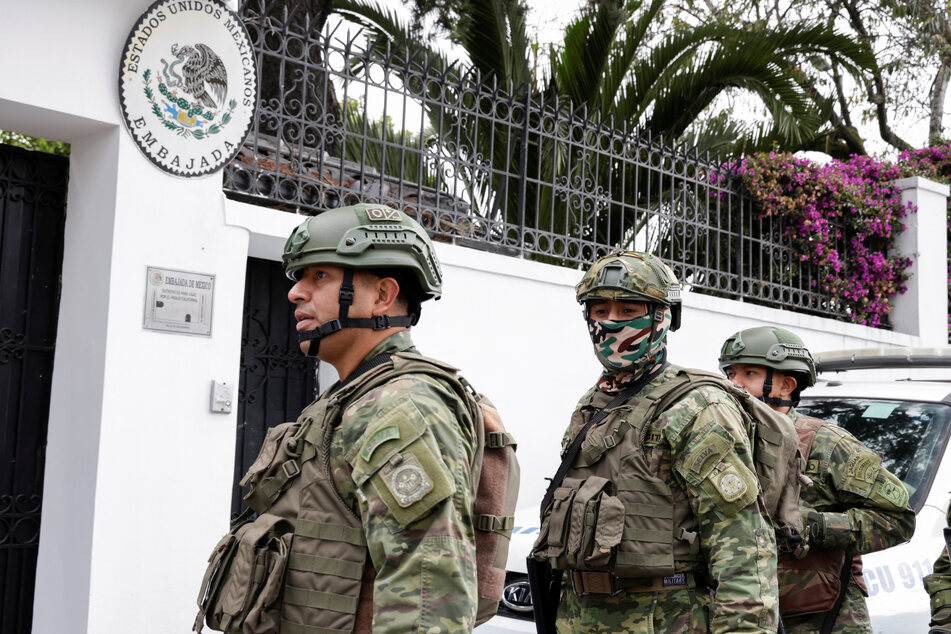 Ecuadorean soldiers stand guard outside Mexico's embassy after Ecuador's government declared Mexico's ambassador to the country, Raquel Serur Smeke, unwelcome.