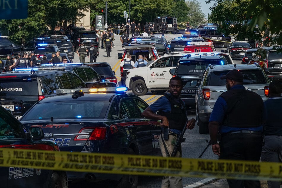 A police officer was killed when a gunman opened fire near Atlanta's CDC headquarters on Friday.