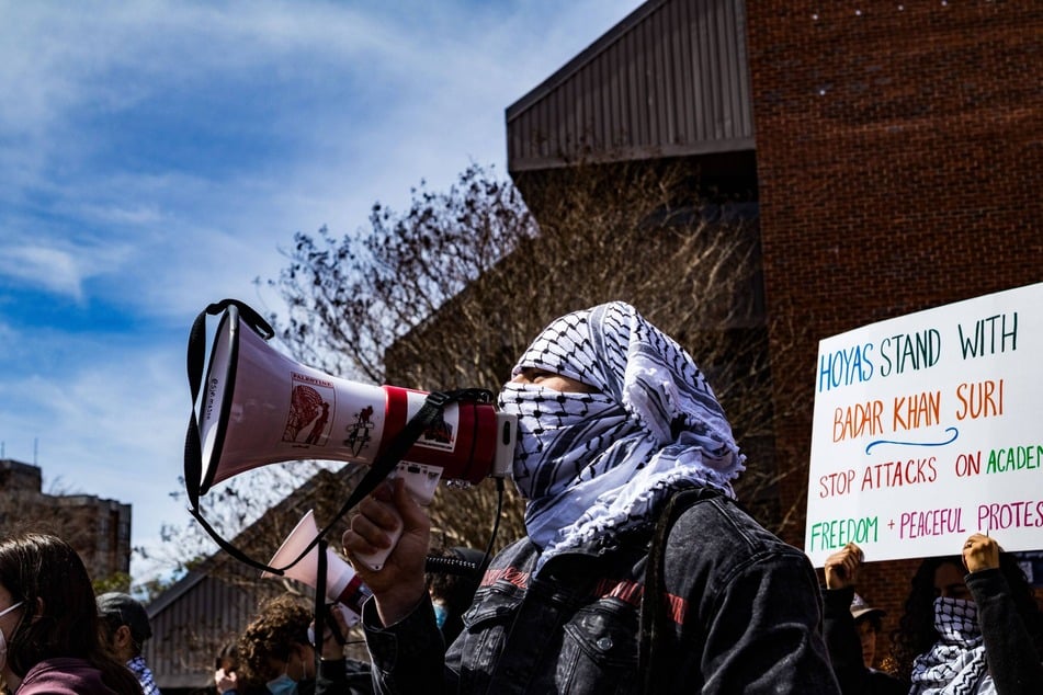 Students, faculty, and members of the community gather on the Georgetown University campus to demand the release of Dr. Badar Khan Suri.