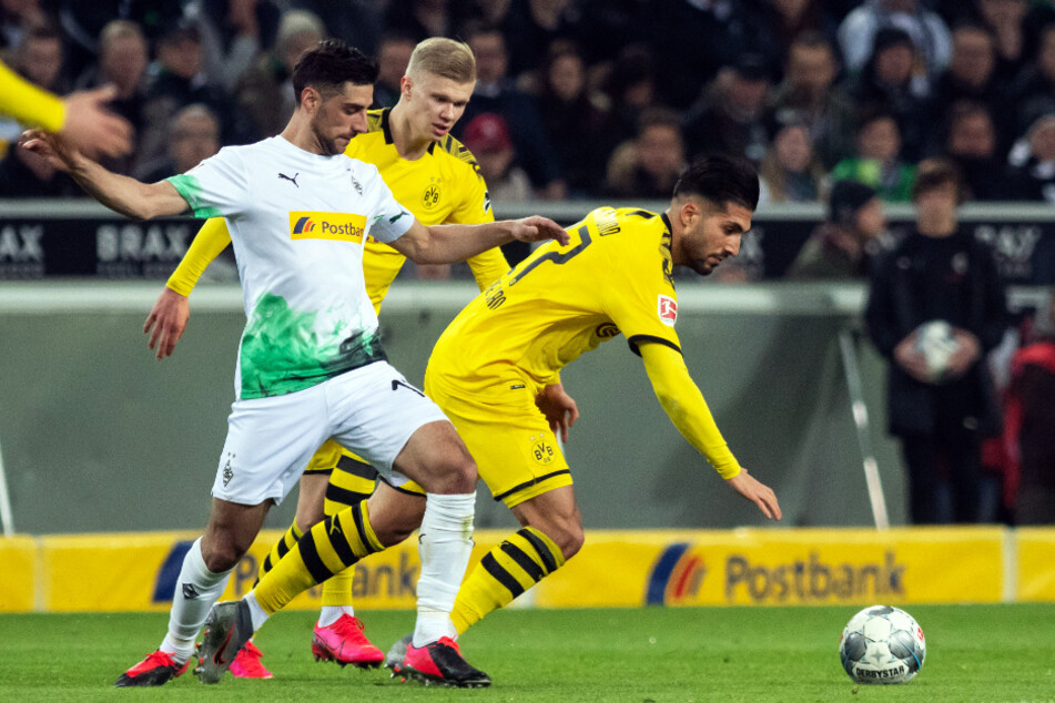 Gladbachs Kapitän und Torschütze Lars Stindl (l.) stieß im ersten Durchgang einmal heftig mit Dortmunds Emre Can (r.) zusammen.
