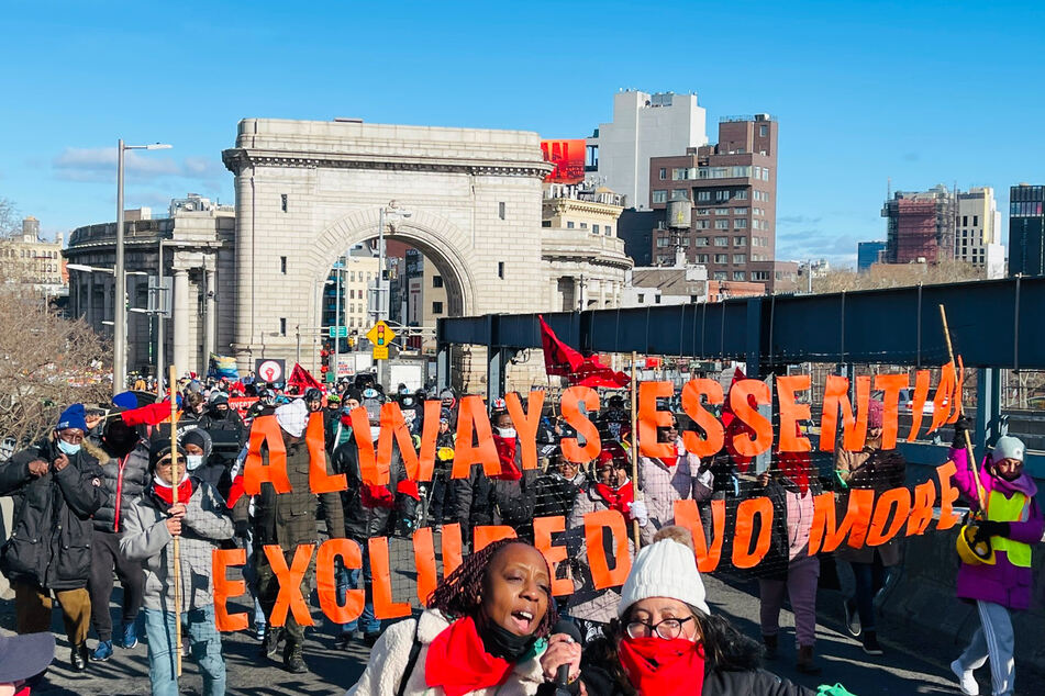 Excluded and immigrant workers and their allies march through New York City demanding a permanent extension to the Excluded Workers Fund.