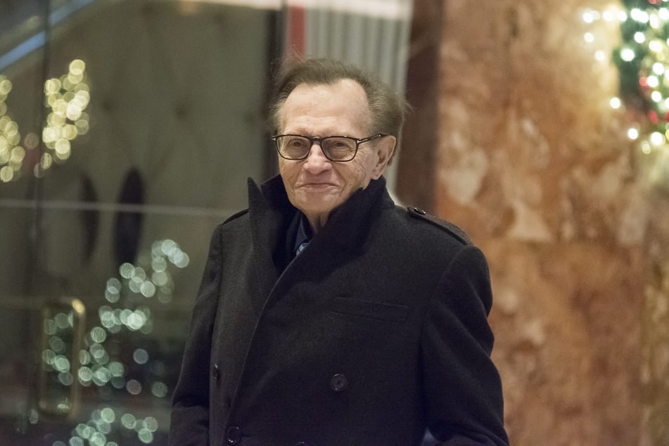 American talk show host Larry King is standing in the lobby of Trump Tower.