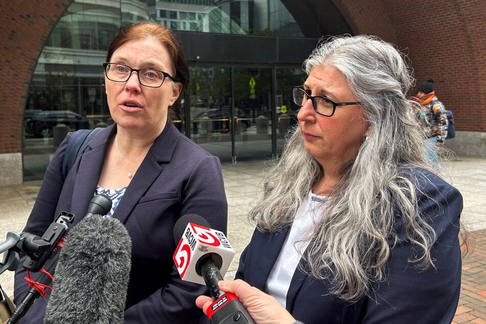 Anwen Hughes, an attorney with Human Rights First, and Trina Realmuto, executive director of the National Immigration Litigation Alliance, speak with reporters outside the federal courthouse after a judge ruled that the Trump administration violated his court order by attempting to deport migrants to South Sudan.