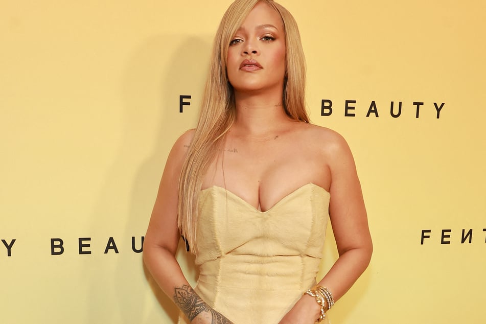 Rihanna flaunted her curves in a head-turning dress for her latest Fenty Beauty event!