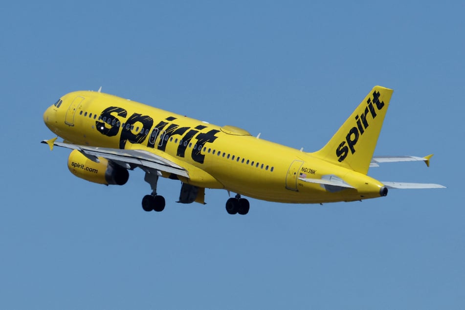 A Spirit Airlines jetliner headed for Haiti's troubled capital was hit by gunfire with one flight attendant suffering minor injuries, the US carrier said Monday.