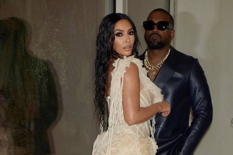 Kim Kardashian and Kanye West strike a pose before heading to the Oscars.
