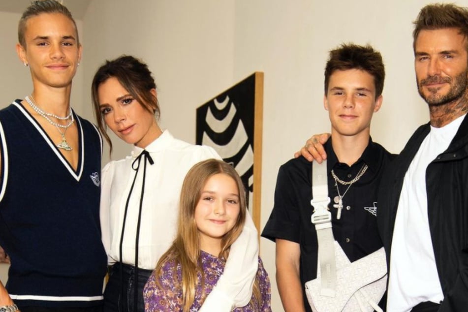 A family photo of the Beckham family.