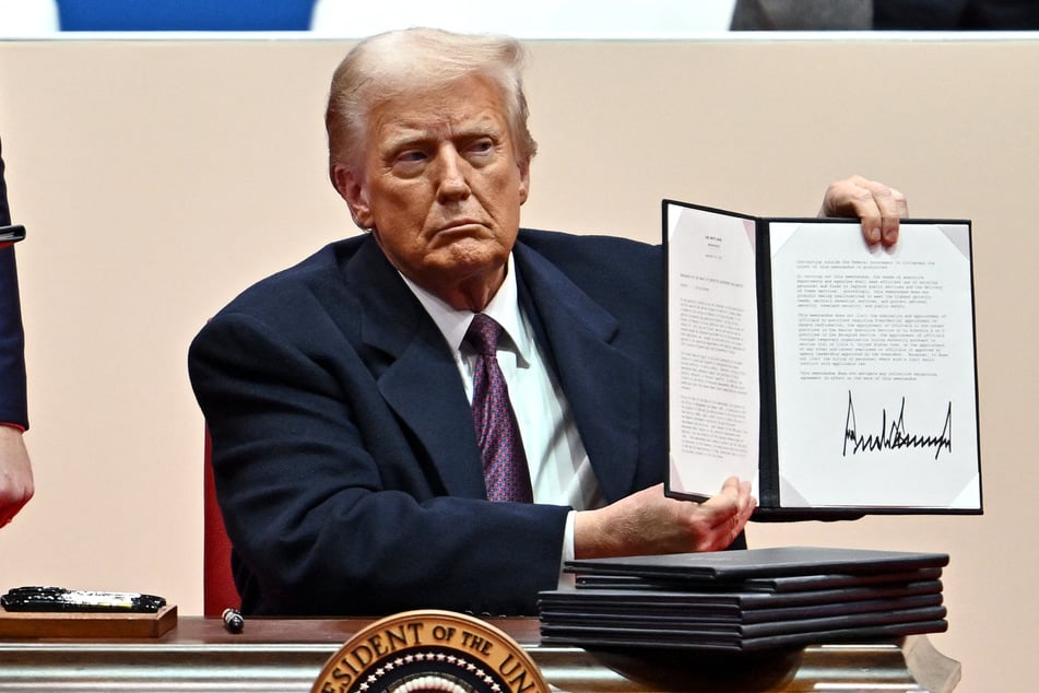 President Donald Trump signed an executive order Monday requiring federal workers return to the office full-time, in one of his first official acts after taking office.