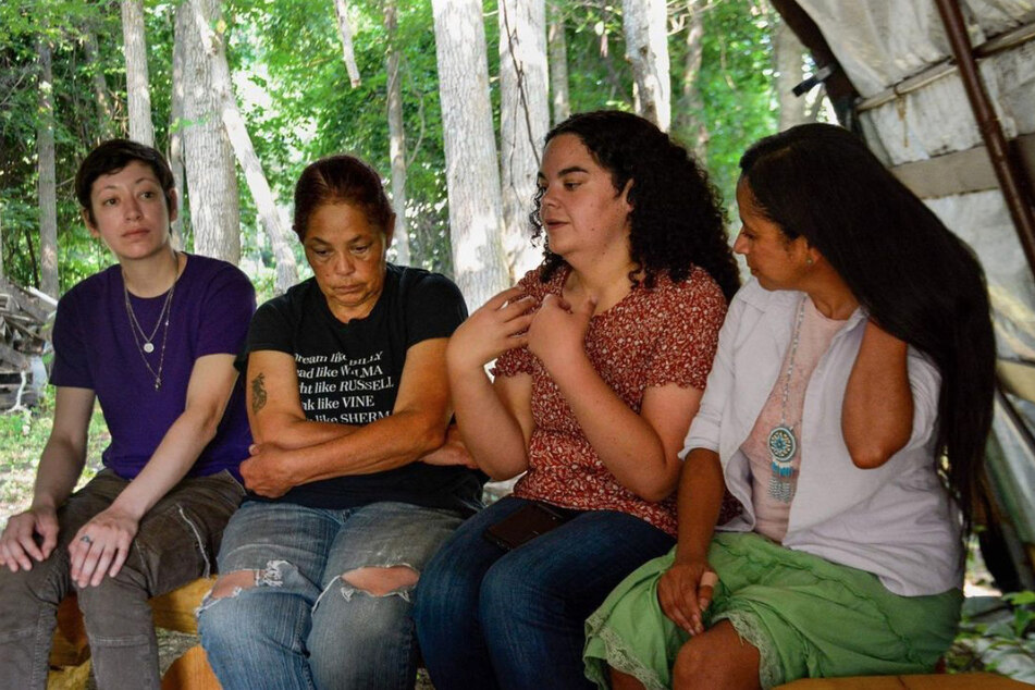 Shinnecock activists, including Becky Hill-Genia (second to l.) and Tela Troge (second to r.), speak on their efforts to restore water quality and create jobs for community members.