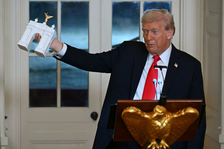 President Donald Trump appears to be visibly satisfied with his planned construction project.