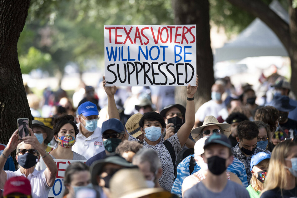 Voting rights advocates of all backgrounds rally against Texas' new restrictive voting law.