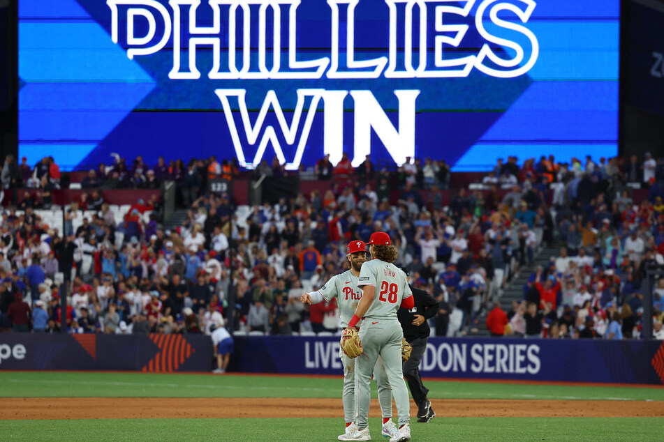 The Philadelphia Phillies' Bryce Harper and Alec Bohm celebrate after winning their game against the New York Mets in London, UK.