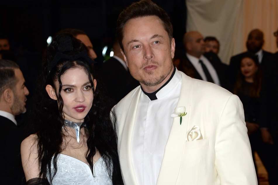 Grimes (l.) and Elon Musk at Heavenly Bodies: Fashion & The Catholic Imagination Costume Institute Gala in New York City in May 2018.