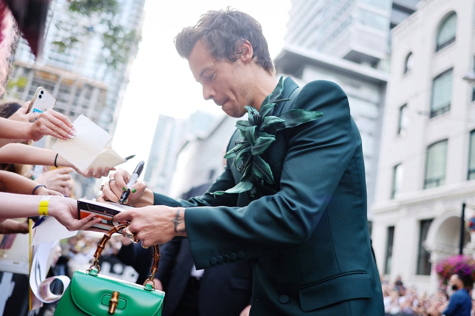 Gucci Criticized For Pics Of Harry Styles Posing With Mattress