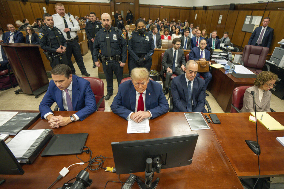 Donald Trump (c.) sitting in the courtroom at the New York County Criminal Court building in New York on Thursday, May 16, 2024.