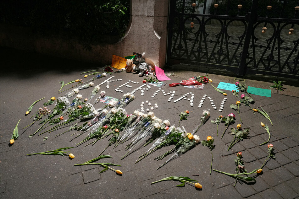 Flowers left in front of the Iranian embassy in Paris after an attack claimed by the Islamic State killed dozens of people at a memorial ceremony for general Qasem Soleimani.