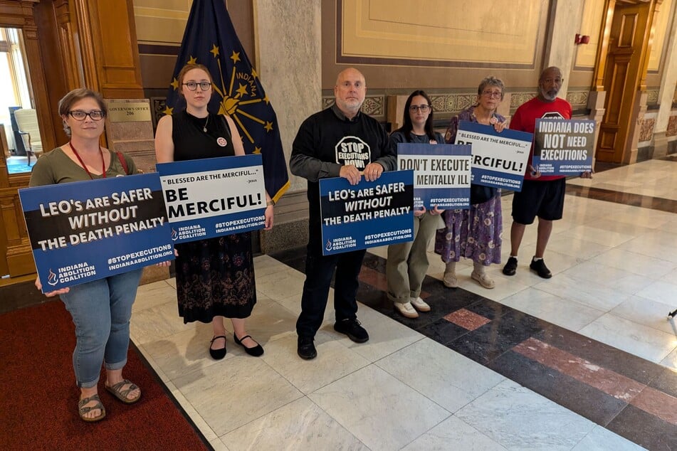 Activists deliver pet!tion signatures to Indiana Governor Mike Braun's office demanding clemency for Benjamin Ritchie.