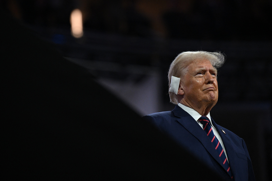 Donald Trump appears with a bandaged ear at the 2024 Republican National Convention in Milwaukee, Wisconsin.