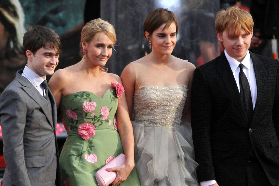 (From l. to r.) Daniel Radcliffe, JK Rowling, Emma Watson, and Rupert Grint attend the global premiere of Harry Potter and The Deathly Hallows: Part 2 in London on July 7, 2011.