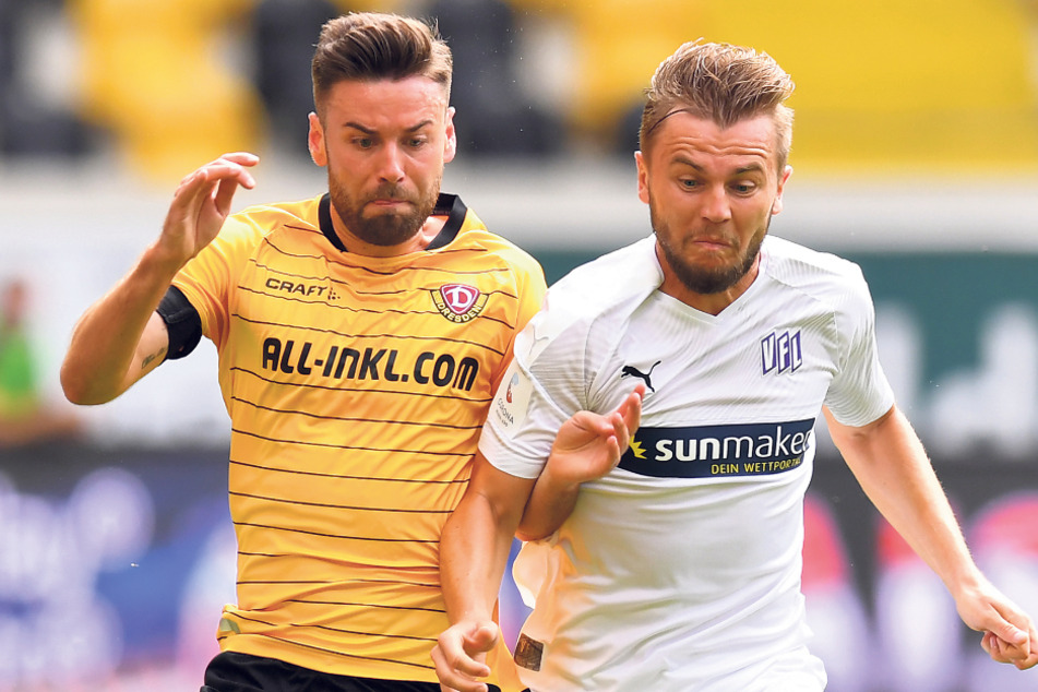 Niklas Kreuzer (l.) in seinem 160. und letzten Spiel für Dynamos Dresden im Zweikampf mit dem Osnabrücker David Blacha.
