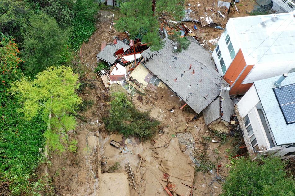 A home destroyed by a mudslide as a powerful long-duration atmospheric river storm, the second in less than a week, continued to impact Los Angeles, California on Monday.