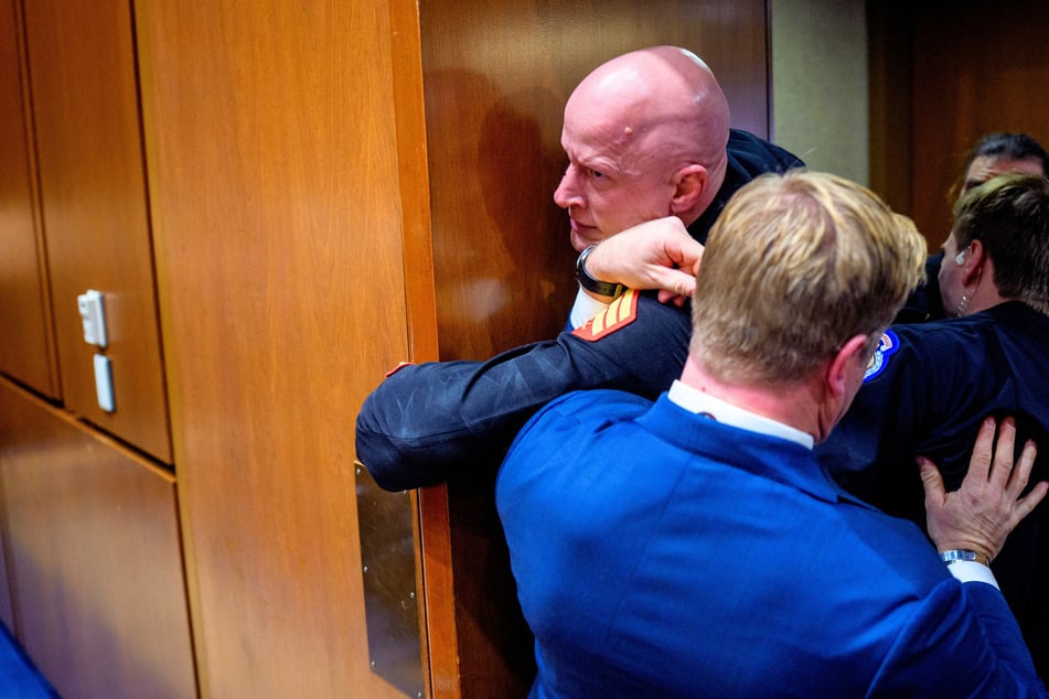 Republican Senator gets into scuffle with anti-war protester during tense hearing