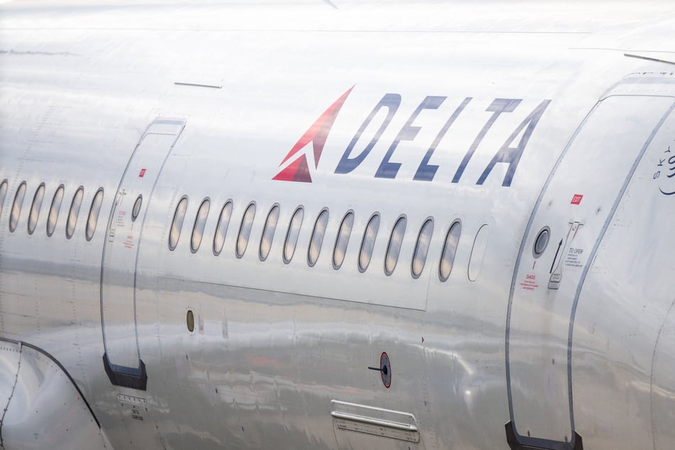 A Delta Airlines plane is stationed at a gate at the Austin-Bergstrom International Airport in Texas.