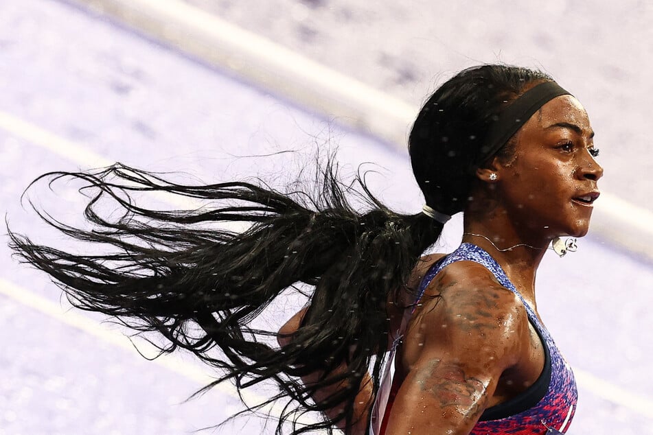 US' Sha'Carri Richardson crosses the finish line to win the women's 4x100m relay final of the athletics event at the Paris 2024 Olympic Games at Stade de France in Saint-Denis, north of Paris, on Friday.