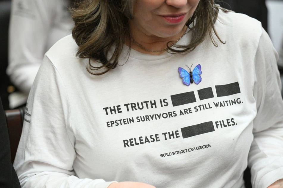 Victims of sex offender Jeffrey Epstein react as Attorney General Pam Bondi testifies before a House Judiciary Committee hearing in Washington, DC, on February 11, 2026.