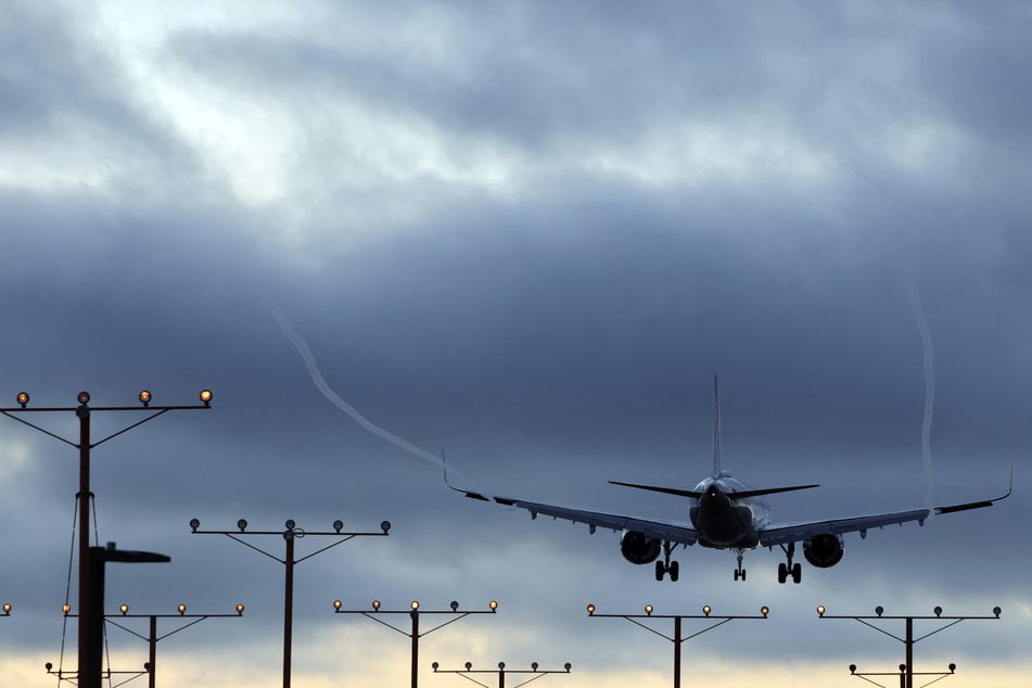 A plane lands at Los Angeles International Airport in California on November 6, 2025.
