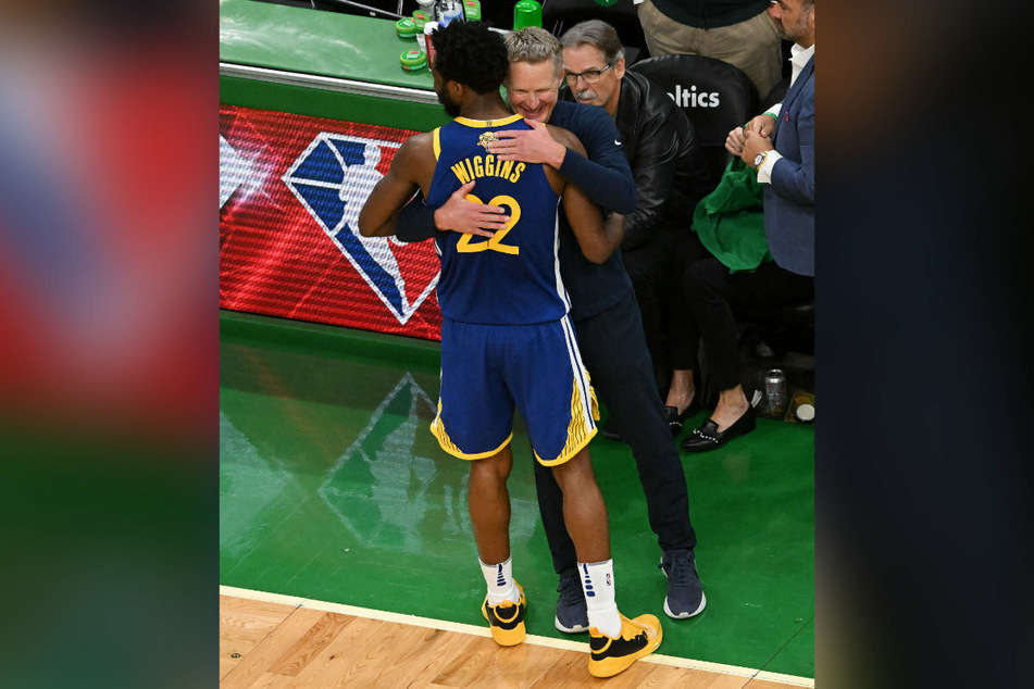 Wiggins gets a hug from Warriors head coach Steve Kerr towards the end of the title-clinching Game 6.