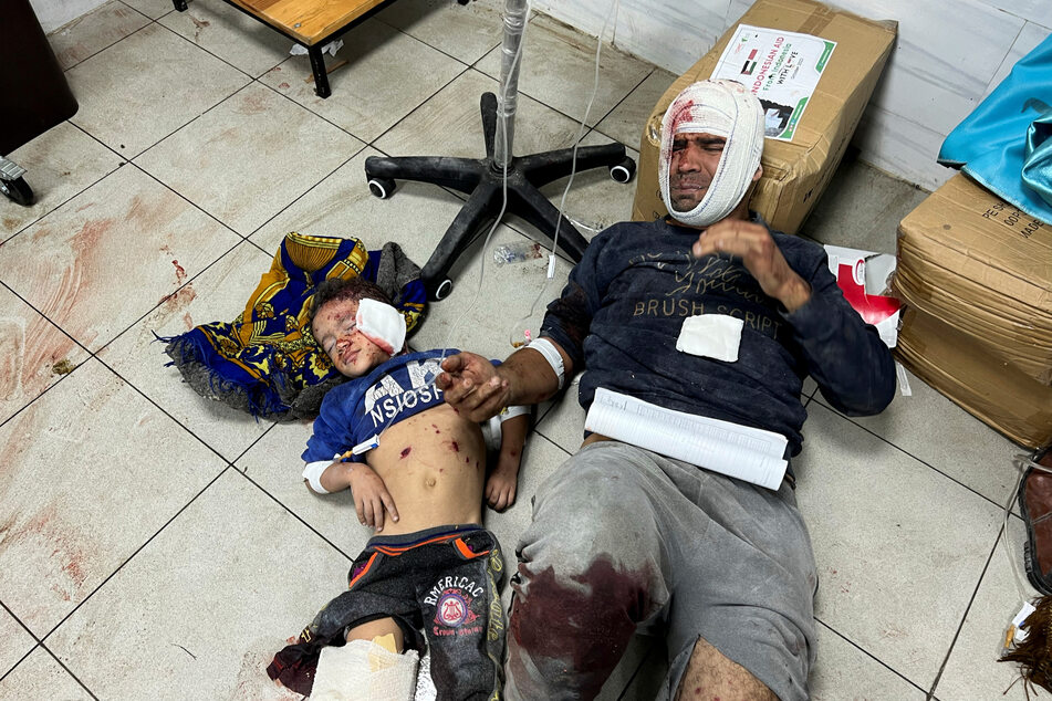 Palestinians wounded in brutal Israeli strikes lie on the floor at the Indonesian Hospital.