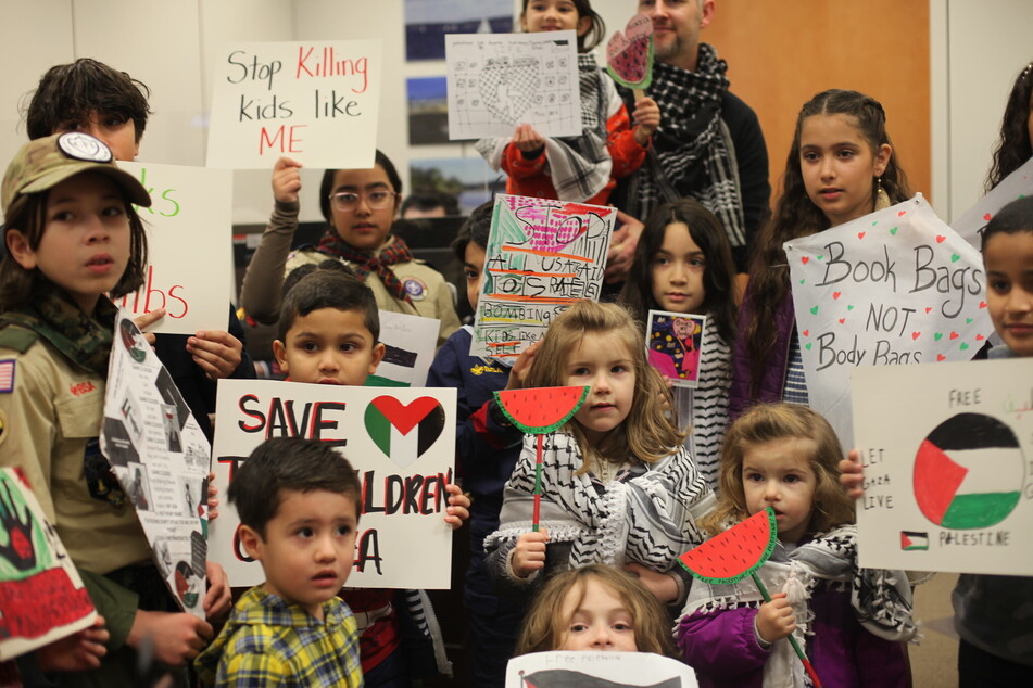 Children visited US Senate offices on Wednesday to call for a ceasefire in Gaza, raising signs that read "Stop Killing Kids like ME" and "Book Bags NOT Body Bags."