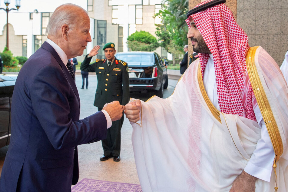 Biden and Saudi Crown Prince Mohammed bin Salman greet each other on Friday.