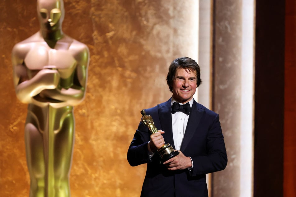 Tom Cruise poses with his honorary Oscar during the Academy of Motion Picture Arts and Sciences 16th Governors Awards in Los Angeles, California, on November 16, 2025.