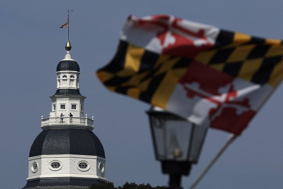 A Maryland State flag flies in front of the State House in the capital city of Annapolis.