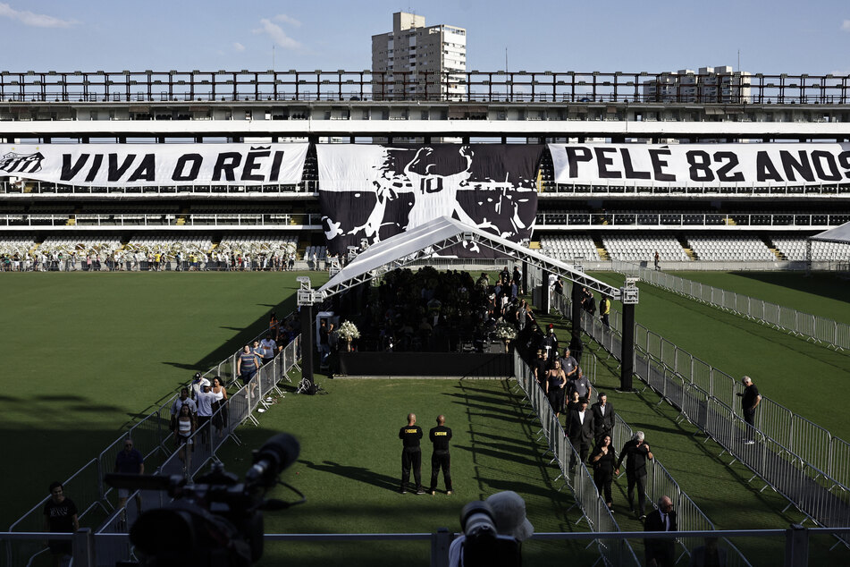 A banner with an image of Pelé is displayed inside Vila Belmiro Stadium in Santos, Brazil.