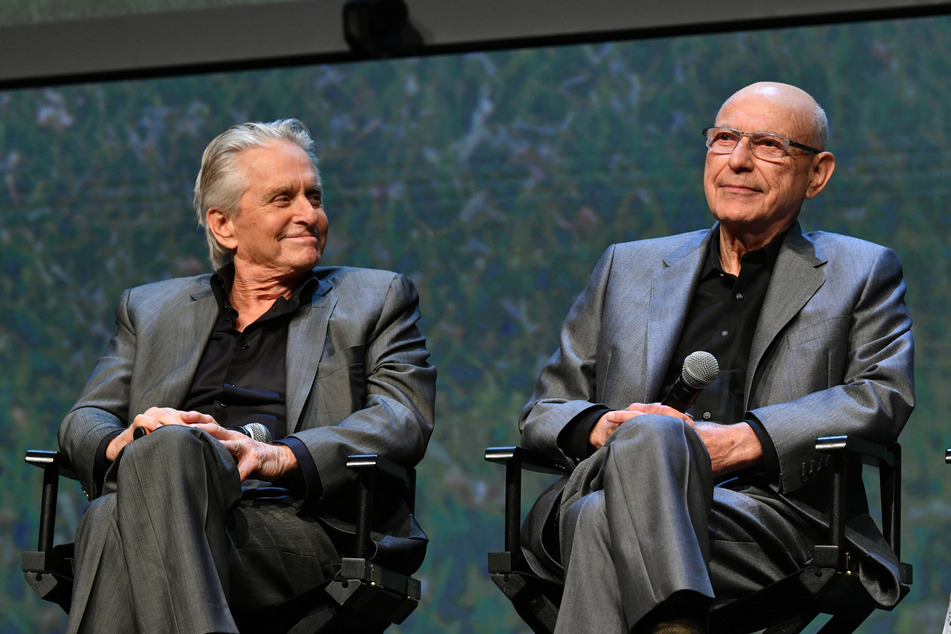 Actors Alan Arkin (r.) and Michael Douglas speak onstage at a Netflix event at Raleigh Studios on June 08, 2019, in Los Angeles, California.