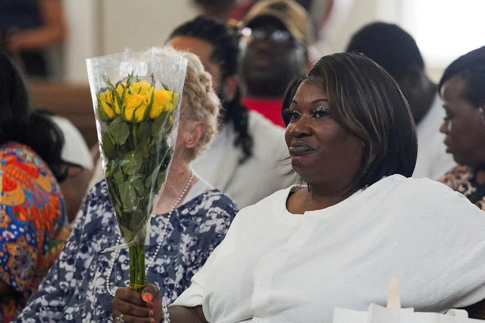 April Newkirk, mother of Adriana Smith, listens to speakers as family and community members gather on her daughter’s birthday to celebrate her life and to rally against Georgia’s abortion ban on June 15, 2025.