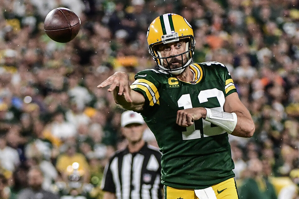 Green Bay Packers quarterback Aaron Rodgers throws a touchdown pass in the second quarter against the Chicago Bears at Lambeau Field.