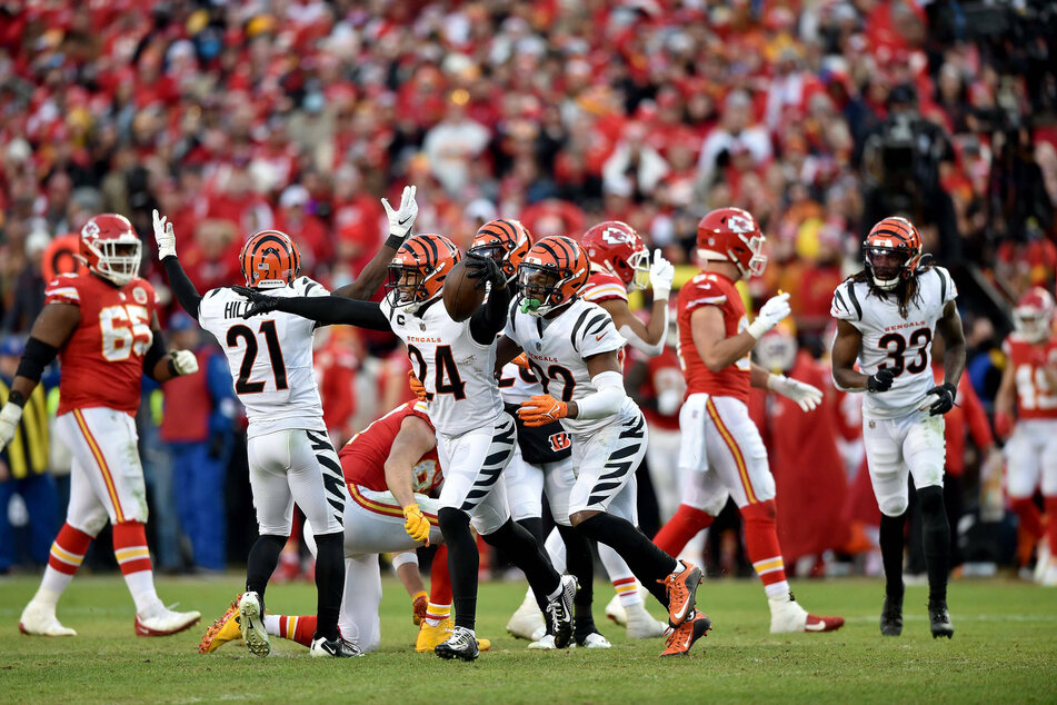 Cincinnati Bengals safety Vonn Bell and his teammates celebrate a crucial interception of Patrick Mahomes' pass in overtime to seal an incredible comeback.