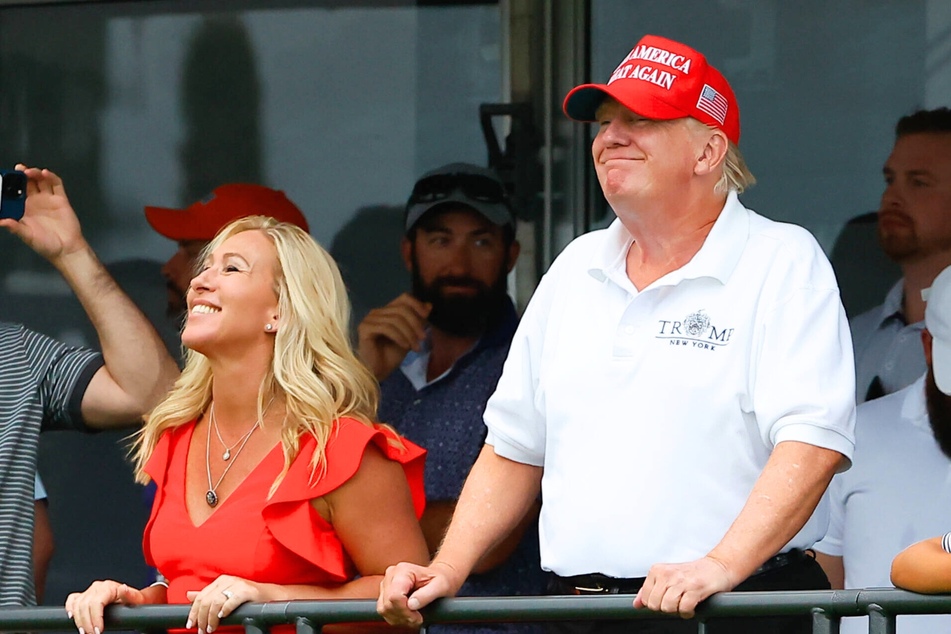 Georgia Congresswoman Marjorie Taylor Greene and Donald Trump at the LIV Golf Invitational Series in Bedminster, New Jersey on July 31, 2022.