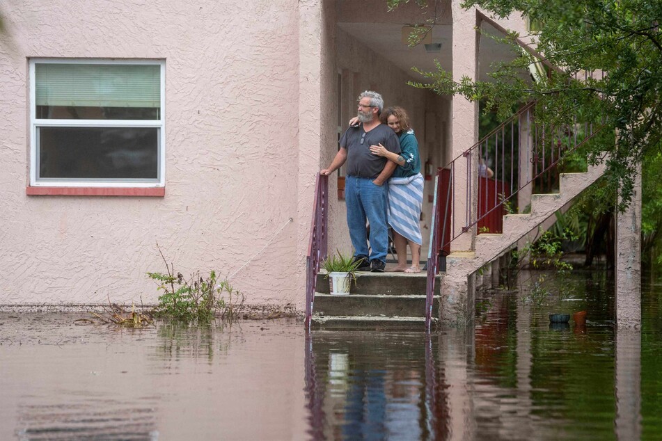 Ken and Tina Kruse ourside their apartment after Hurricane Idalia blew through Tarpon Springs, Florida, on Wednesday.