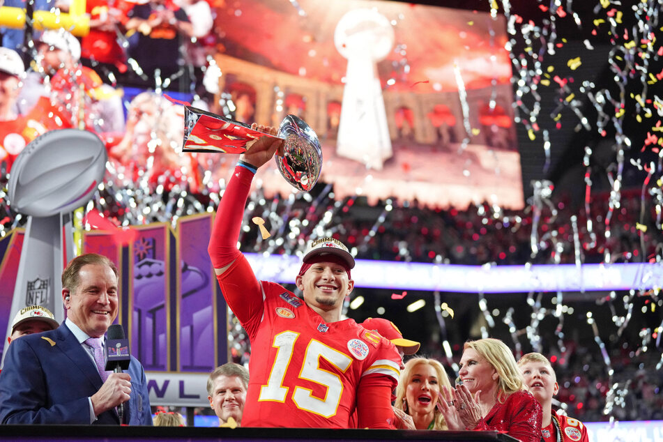 Kansas City Chiefs quarterback Patrick Mahomes hoists the Vince Lombardi Trophy after defeating the San Francisco 49ers in Super Bowl LVIII at Allegiant Stadium.
